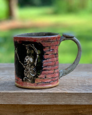 Peaking skull with dancing Skeleton Mug